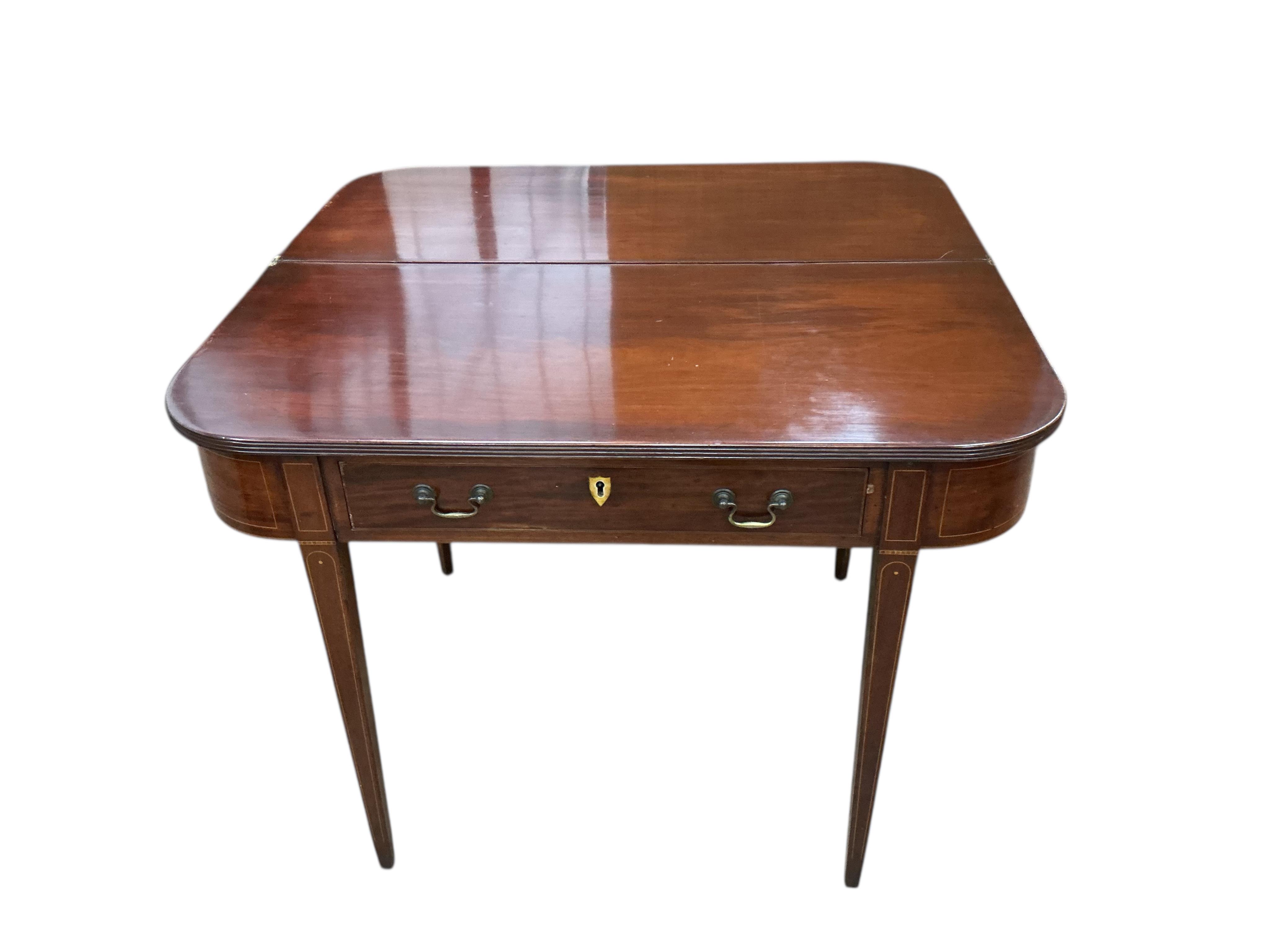 A George III mahogany D shaped folding tea table, width 97cm, depth 46cm, height 75cm